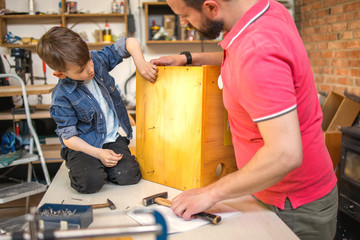 	
Father and Son Making a Birdhouse