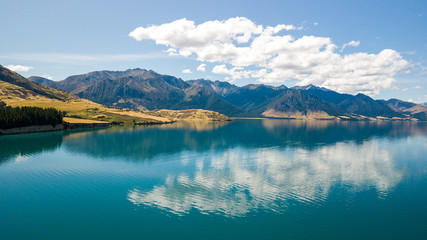 Reflection of lake Hawea in South island, New Zealand