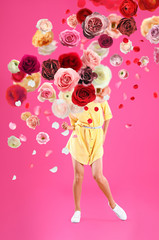 Creative spring fashion composition. Dancing girl and flowers splash