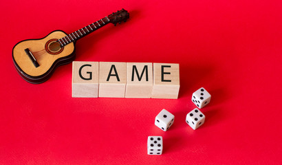 dice and guitar on a red background