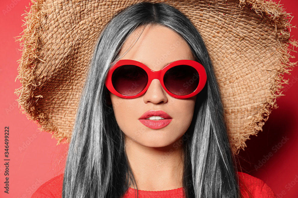 Sticker Portrait of young woman with beautiful grey colored hair on red background