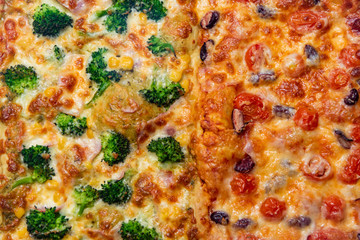 Close up fresh pizza with broccoli, beans, cheese, cherry tomatoes.