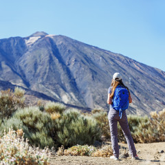 Naklejka premium Young tourist woman near the Teide volcano