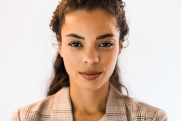 Portrait of beautiful african american woman looking at camera and thinking.