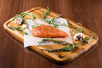 raw fillet with spices and rosemary for grilling
