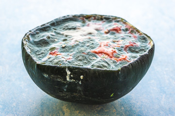 A rotten half cut watermelon