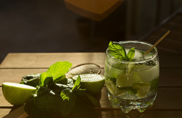 Glass of lemonade with mint and lime and sugar. Indian nimbu pani/ shikanji. 