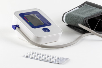 Check your blood pressure and heart rate with a digital pressure gauge for standard blood pressure readings. Health and medical concept.