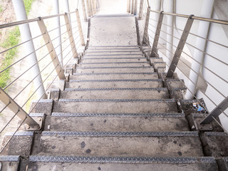 the building staircase for descending from footbridge.