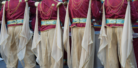 People from behind with carnival costume