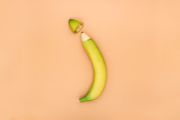 Concept of male circumcision, banana with the tip of the peel cut off