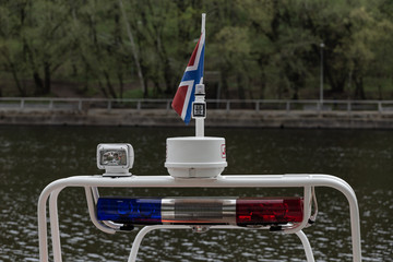 Flag and lanterns of a police river boat