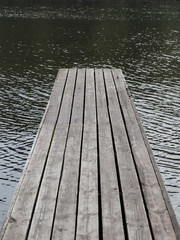 Wooden pier and river water