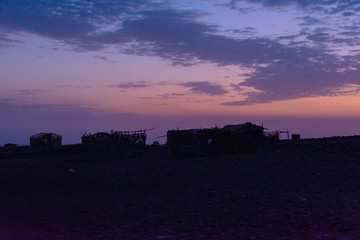 Huts in Danakil desert at twilight, Ethiopia