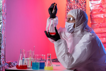 Laboratory technician working with a pipette in a molecular laboratory. A modern scientist works in...