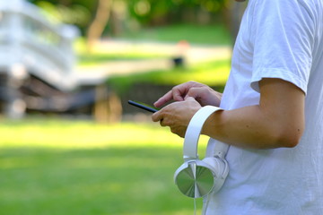 Young man using a smartphone working in home and Online shopping, freelance, online learning, worked at home office concept