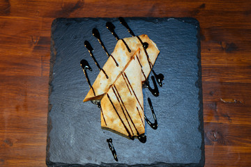 Burritos wraps with beef and vegetables on a black background. Beef burrito, Mexican food. chicken and sauce, pita bread, Shawarma