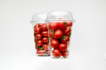 Red cherry, great design for any purposes. White table background. Isolated yellow background. Tomatoes isolated. Cherry background.