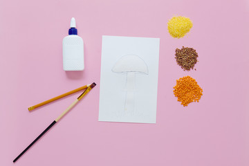 children's crafts using different cereals. step by step instruction. Step 2 - draw a mushroom with a pencil and cover it with glue