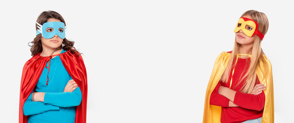 Girls with arms crossed in heroes costumes