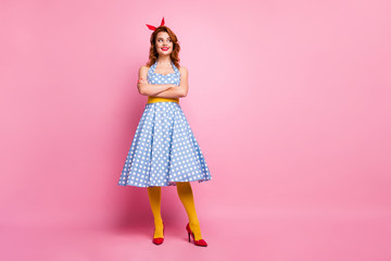 Full body photo of cheerful pretty cute sweet lady cross hands look copyspace wear polka-dot clothes tights isolated over pink color background