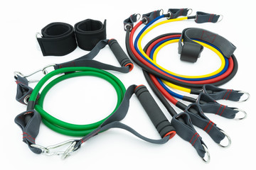 A set of colorful resistance bands,door anchor and foot ring isolated on the white background.