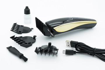 A set of the cordless electric hair clipper isolated on the white background.