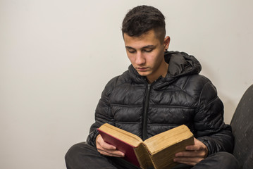 
young man reading on the couch