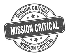 mission critical stamp. mission critical label. round grunge sign