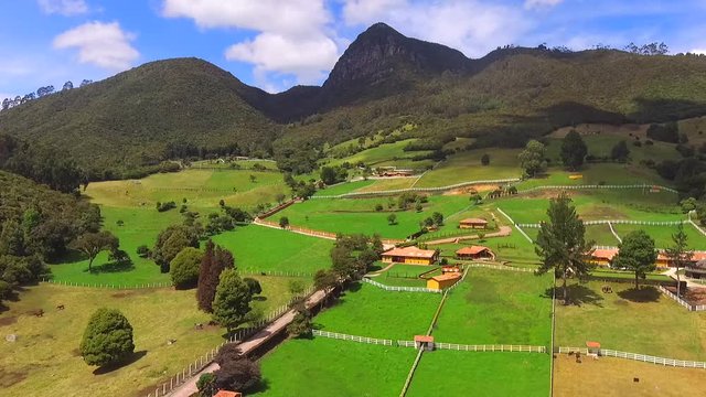 High mountains of mythical figures, trees and a clear sky all in Tabio