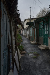 Slums of Russia. Old poor street in the rain. The resort city of Russia Kislovodsk. Rain in a poor quarter.