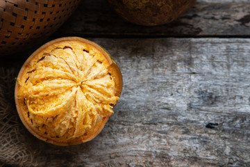 exotic Indian Bel fruit or wooden Apple. Bel fruit slices on wooden rustic background. natural detox. vitamins for immunity