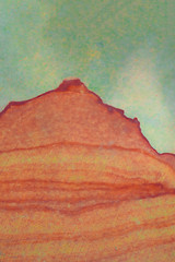 Colorful picture who depicts a barren orange mountain similar to the ones that you see in The Great Canyon in USA. The green color of the sky emphasizes the dreamy vision of this illustration.