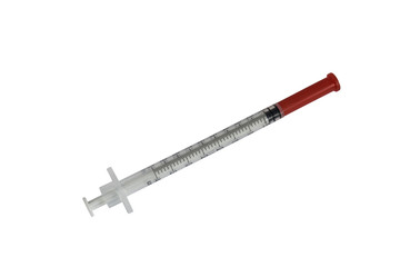 Plastic insulin syringe isolated on white background with a red cap
