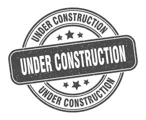 under construction stamp. under construction label. round grunge sign