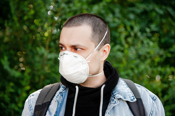 A man with a backpack look on the left