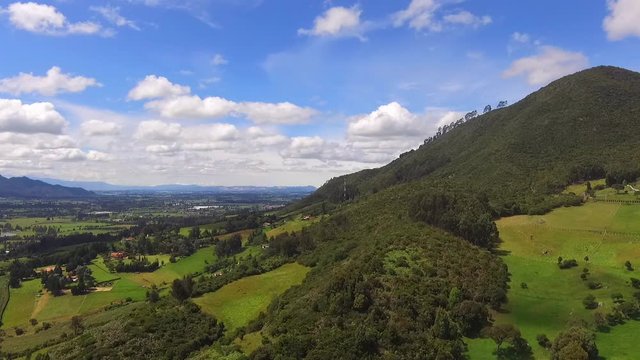 High mountains of mythical figures, trees and a clear sky all in Tabio