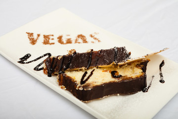 Cheesecake with apple on a white background, chocolate watering.