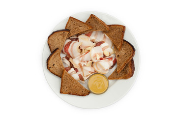 Bread with lard and sauce on a white plate. Photo for the menu