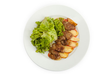 Fried meat, herbs, sauces, potatoes, on a wooden board