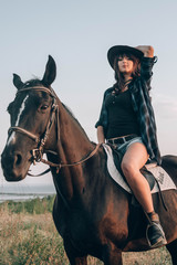 beautiful stylish fashion woman near horse on ranch. Fashion girl hugging a horse.
