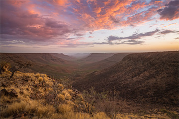 View from Grootberg plateau into the valley of the Klip River with a stunning sunset. Namibia, Africa