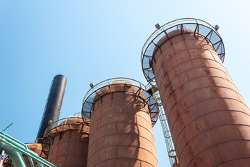 Sloss Furnaces National Historic Landmark, Birmingham Alabama USA, row of steel mill furnaces against a blue sky, copy space, horizontal aspect