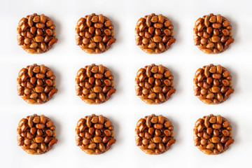 Tasty eastern sweets kozinaki made from peanuts and honey on a white background. Isolated.