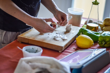 Obraz na płótnie Canvas cooking with tablet - checking recipe