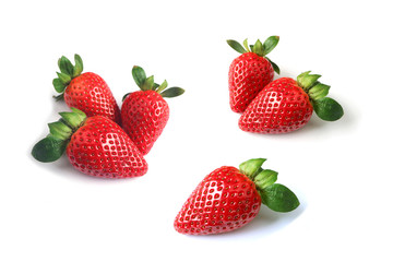 Fresh ripe strawberries scattered on white background