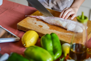 preparing anglerfish to be cooked (Lophius piscatorius)