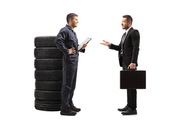 Auto mechanic talking with a businessman