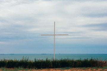 Fototapeta na wymiar big cross with sea on the background