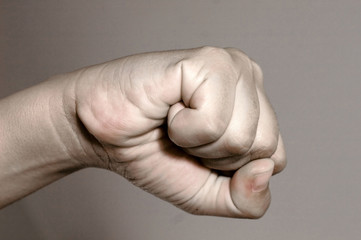 Punching Fist on gray background